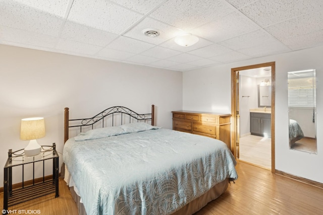 12524 Grandview Dr, Huntley, IL 60142 - bedroom featuring baseboards, a paneled ceiling, light wood-type flooring, and ensuite bath