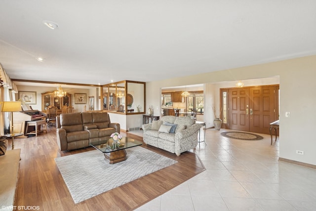 12524 Grandview Dr, Huntley, IL 60142 - living area with a chandelier, light tile patterned floors, baseboards, and recessed lighting