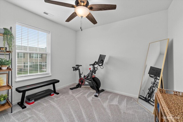 workout room featuring visible vents, a ceiling fan, baseboards, and carpet floors