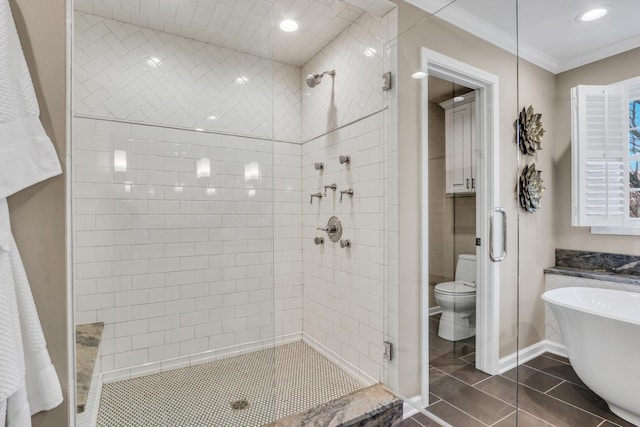 full bathroom featuring recessed lighting, a freestanding tub, tile patterned flooring, a shower stall, and crown molding