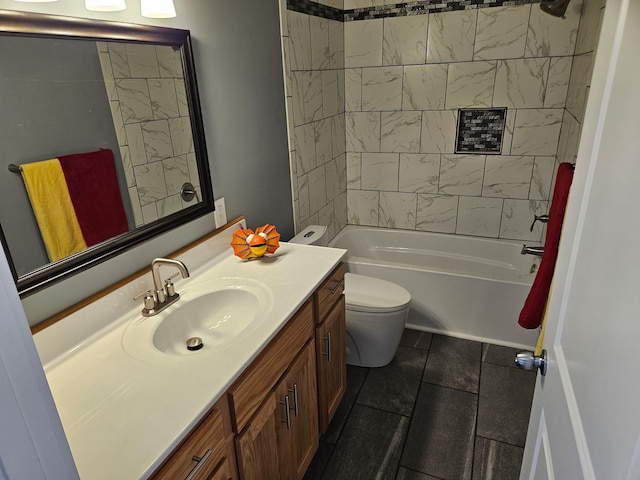 bathroom featuring toilet, vanity, and bathtub / shower combination