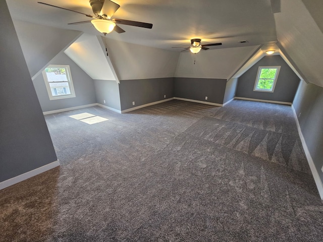 additional living space featuring ceiling fan, carpet, baseboards, and vaulted ceiling