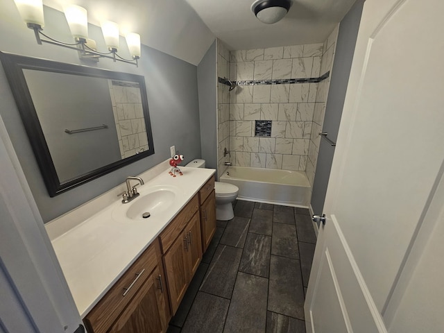 bathroom featuring vanity, toilet, and shower / bathtub combination