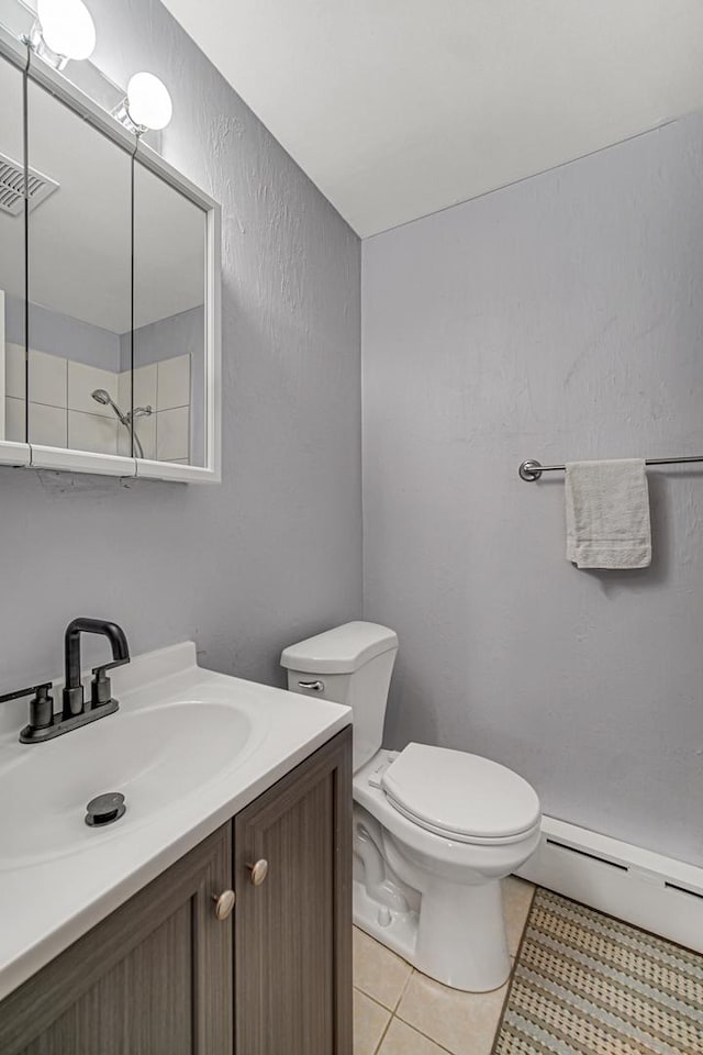 bathroom featuring tile patterned floors, visible vents, toilet, vanity, and a baseboard radiator