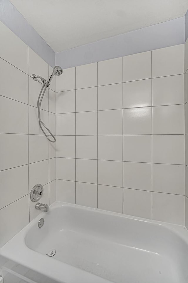 bathroom featuring washtub / shower combination
