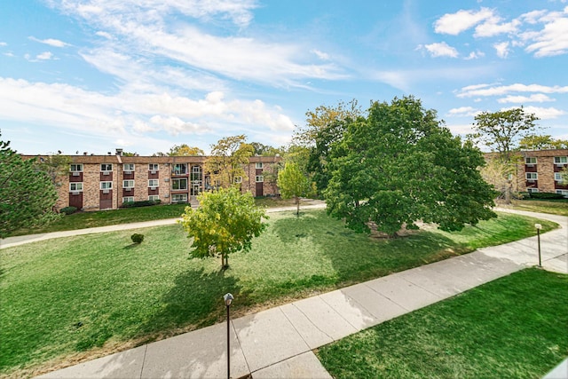surrounding community with a yard