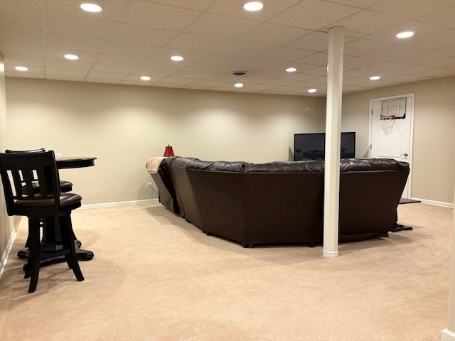 living room featuring light colored carpet, recessed lighting, and baseboards
