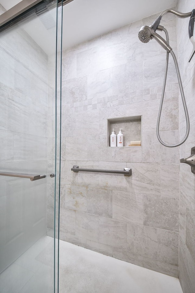 full bathroom with a shower stall
