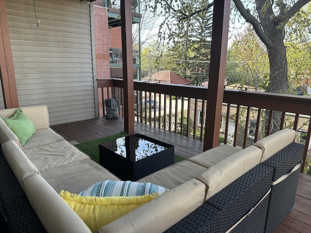 wooden deck featuring an outdoor living space