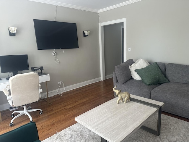 office space with crown molding, baseboards, and wood finished floors