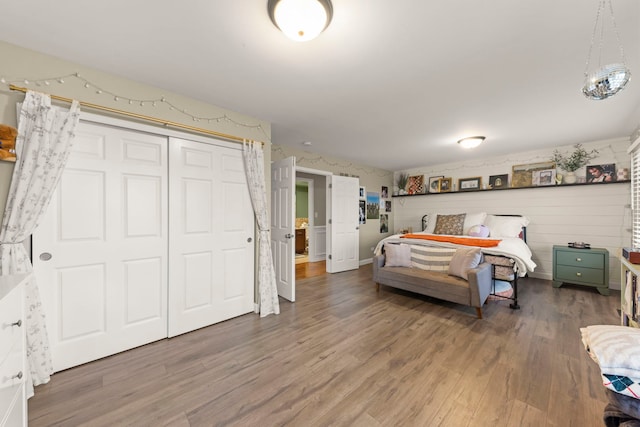 bedroom featuring wood finished floors and a closet