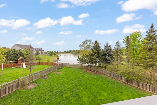 view of yard with a playground and a water view