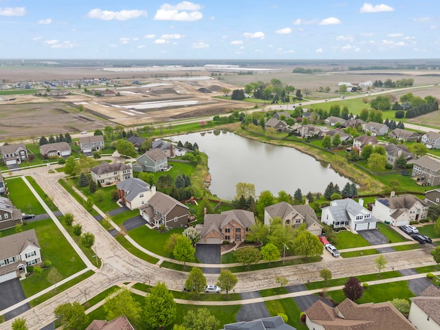 aerial perspective of suburban area featuring a large body of water