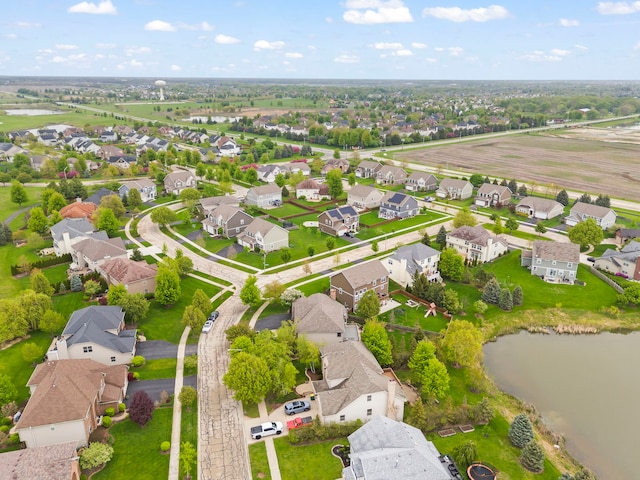 aerial perspective of suburban area featuring a nearby body of water