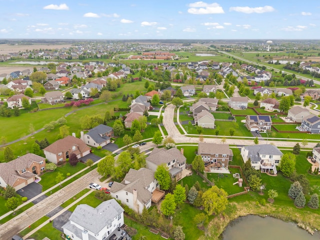 aerial perspective of suburban area with a large body of water