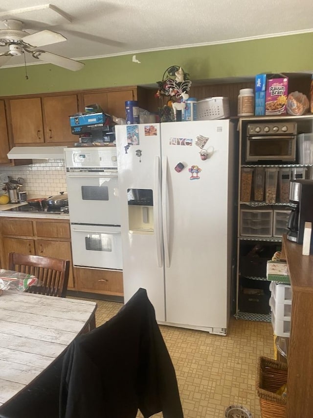 1716 Rogers Ave, Mchenry, IL 60050 - kitchen featuring white appliances, a ceiling fan, brown cabinets, and under cabinet range hood