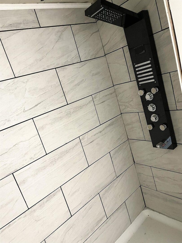 room details with a tile shower