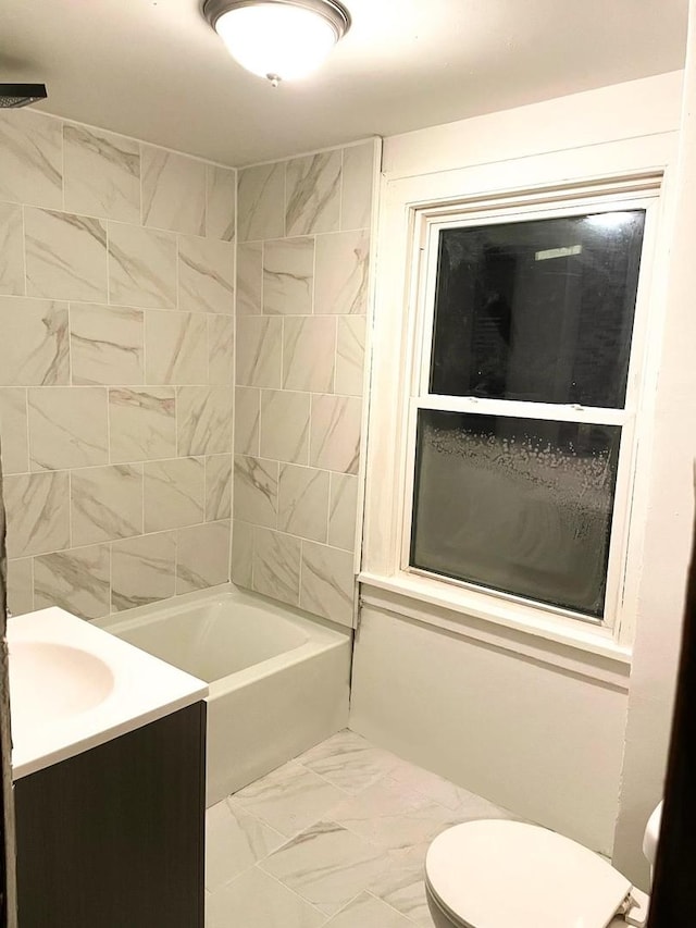 full bath with vanity, marble finish floor, tub / shower combination, and toilet