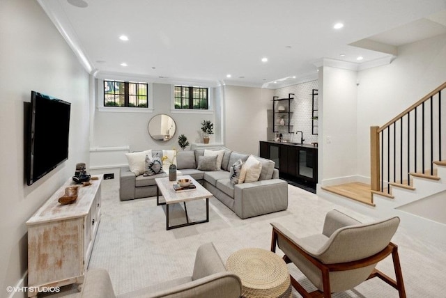 living room with ornamental molding, stairs, and recessed lighting
