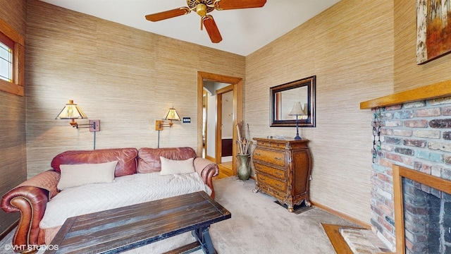 living room featuring a fireplace with flush hearth, carpet, and ceiling fan
