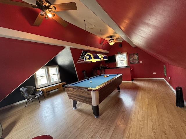 recreation room with lofted ceiling, wood finished floors, and ceiling fan