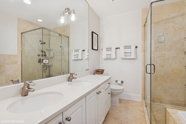 full bath featuring a sink, double vanity, and a shower stall