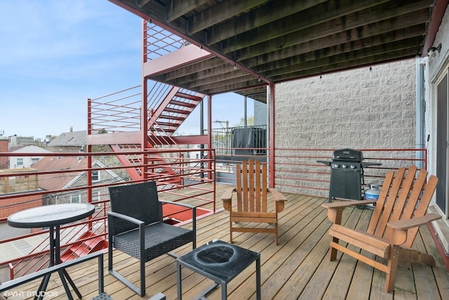 wooden terrace featuring stairway and grilling area