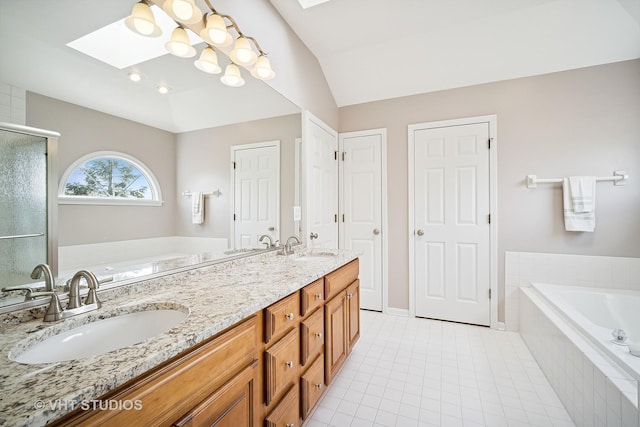full bath featuring double vanity, a sink, a bath, and a stall shower