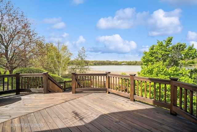 deck featuring a water view