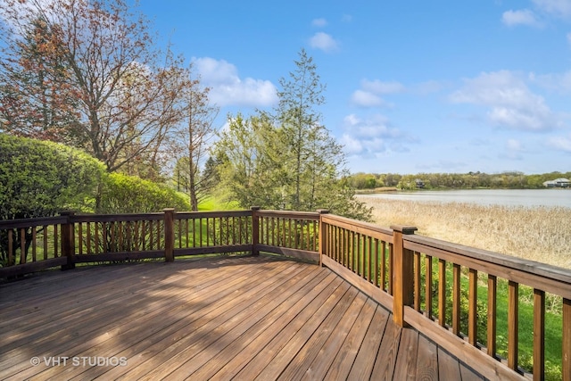 wooden terrace featuring a water view