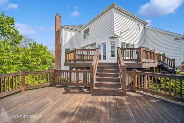 wooden terrace featuring stairway