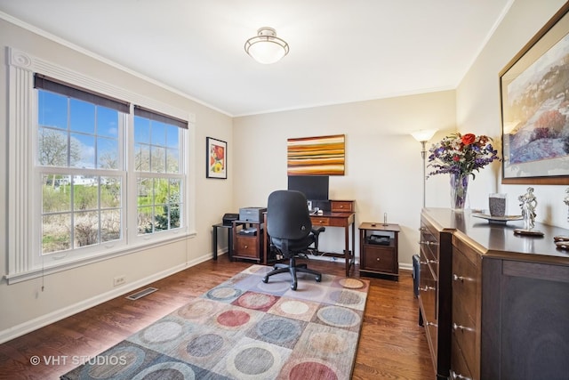 office space featuring baseboards, visible vents, ornamental molding, and dark wood-type flooring