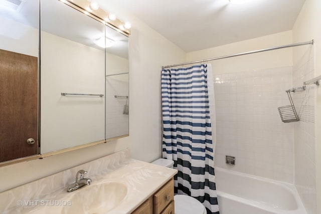 bathroom with vanity, toilet, shower / tub combo, and visible vents
