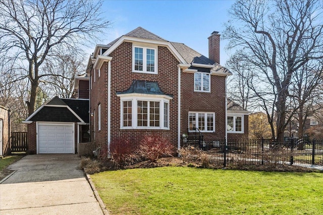2341 Lincolnwood Dr, Evanston, IL 60201 - view of front of house with brick siding, a front lawn, a chimney, and fence