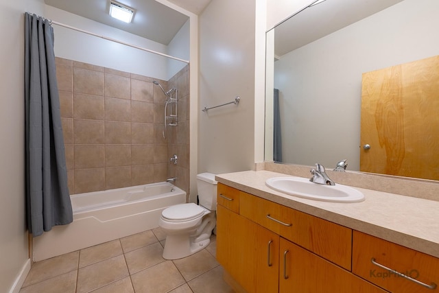 full bathroom featuring toilet, vanity, tile patterned floors, and shower / tub combination