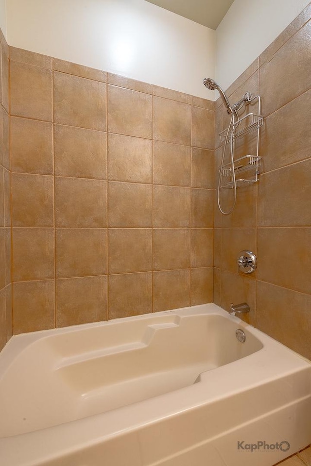bathroom with washtub / shower combination