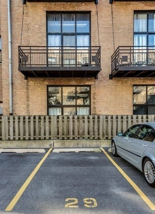 view of building exterior featuring uncovered parking
