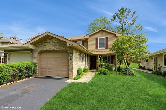view of front of house featuring a garage, asphalt driveway, a front yard, and stone siding