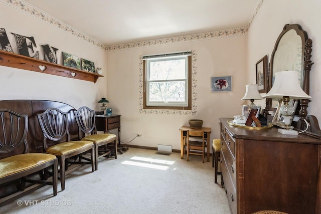 sitting room featuring carpet floors and baseboards