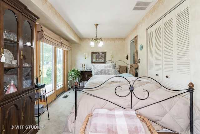 bedroom featuring light colored carpet and a closet