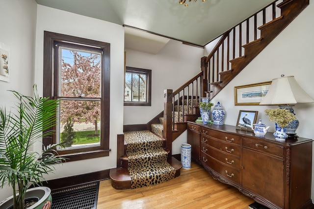 stairway with wood finished floors