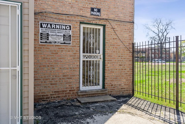 7010 S E End Ave Unit 4, Chicago, IL 60649 - entrance to property featuring fence and brick siding