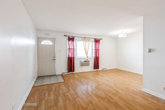 7010 S E End Ave Unit 4, Chicago, IL 60649 - entrance foyer with light wood-style flooring, a wealth of natural light, and baseboards