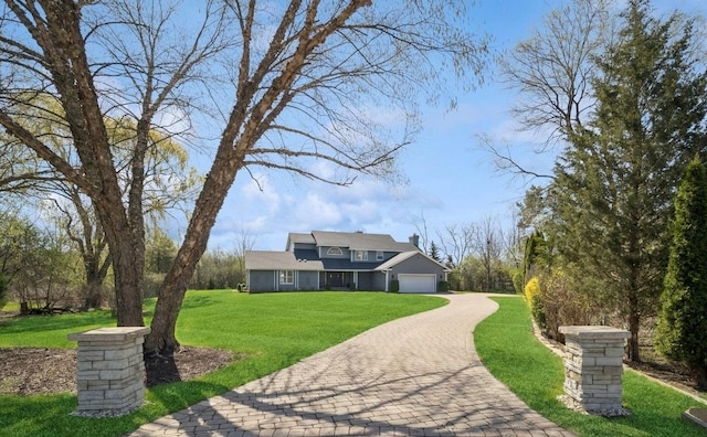 5364 Hedgewood Ct, Long Grove, IL 60047 - view of front of home featuring an attached garage, decorative driveway, a front lawn, and a chimney