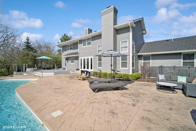 5364 Hedgewood Ct, Long Grove, IL 60047 - back of property with a chimney, a patio, fence, and french doors