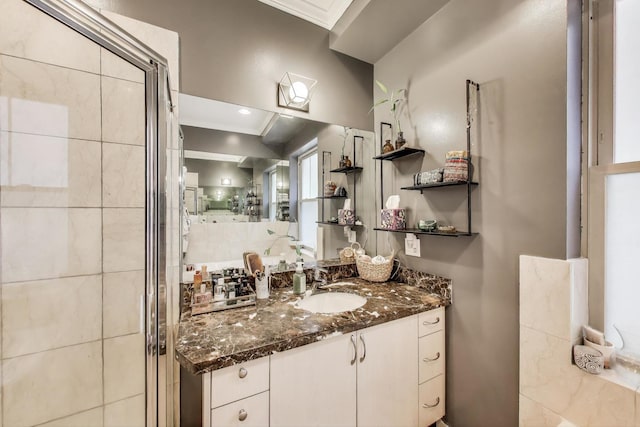 full bath with vanity and a shower stall