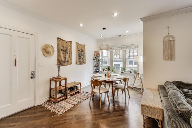 dining space with dark wood-style flooring, recessed lighting, baseboards, visible vents, and ornamental molding