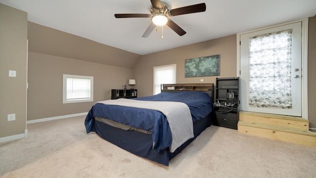 carpeted bedroom featuring a ceiling fan and baseboards