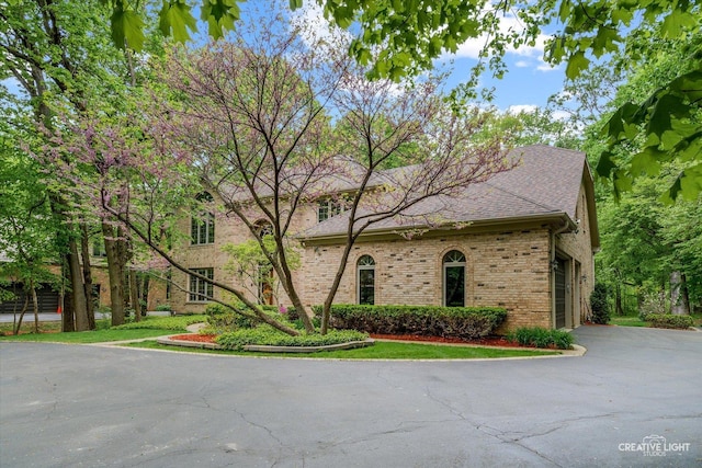 view of front of home with brick siding