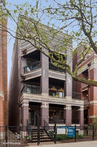 view of building exterior with a fenced front yard